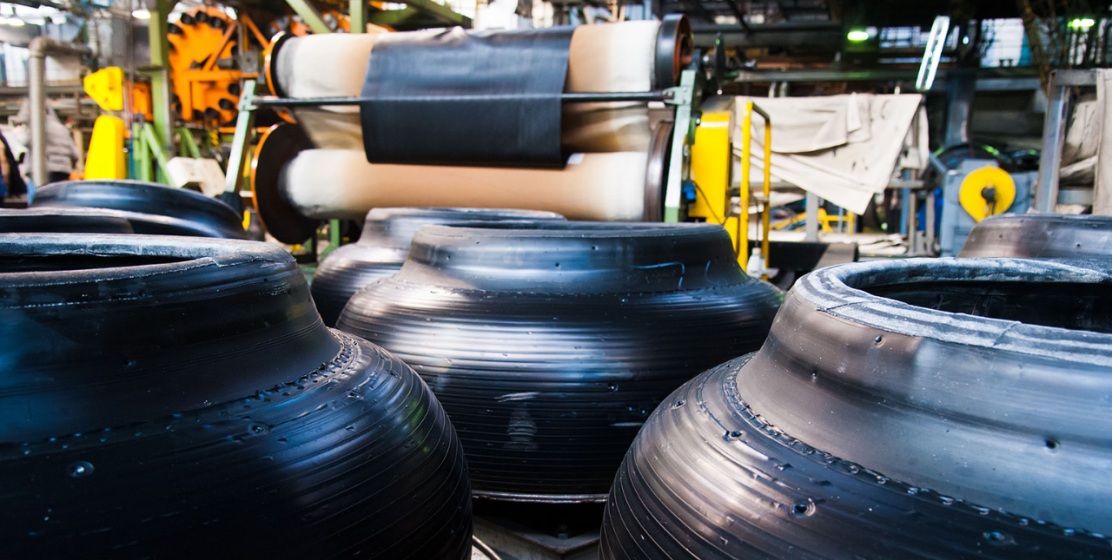 Tire manufacturing facility with partially finished tires