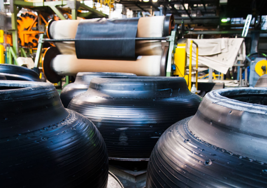 Tire manufacturing facility with partially finished tires